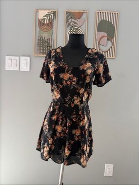 Sienna Sky Black Floral Short-Sleeve Romper with Orange and Cream Blooms